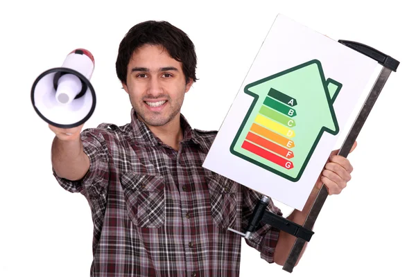 Hombre sosteniendo megáfono y bandera de eficiencia eléctrica — Foto de Stock