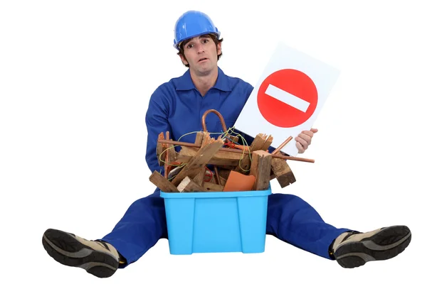 Woodworker sat with box of waste — Stock Photo, Image