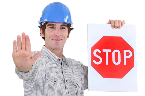 Builder holding stop sign — Stock Photo, Image