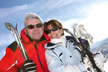 Mature ski couple clipart