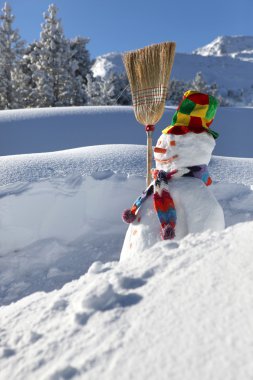 Snowman on a mountain clipart