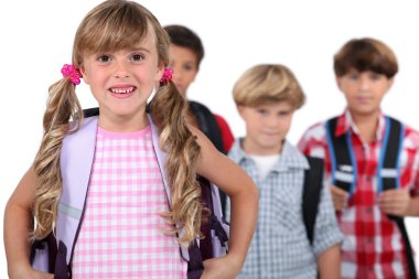 Four young children with backpacks clipart