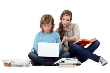 Two young studying together clipart