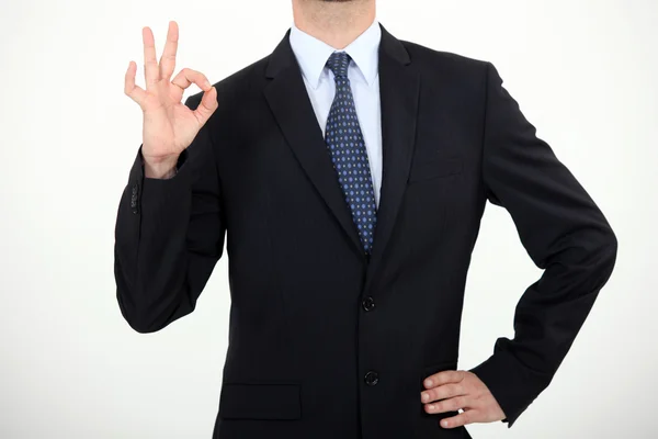 Empresário fazendo gesto de polegar para cima — Fotografia de Stock