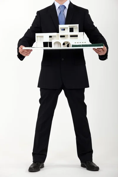 Architect presenting model housing — Stock Photo, Image