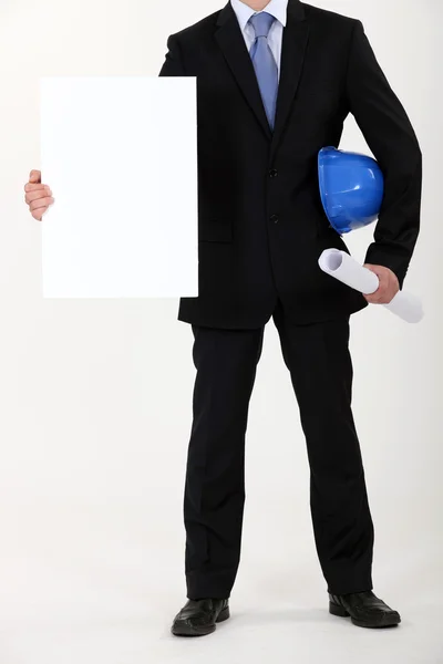 Architect with plans and blank message board — Stock Photo, Image