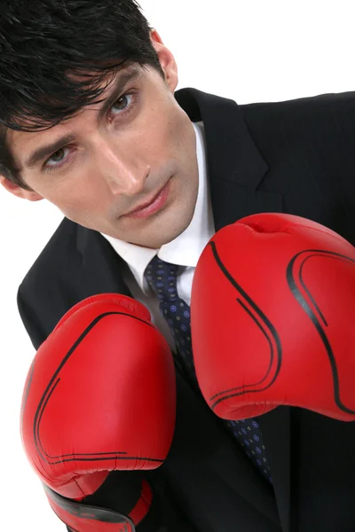 Businessman wearing boxing gloves — Stock Photo, Image