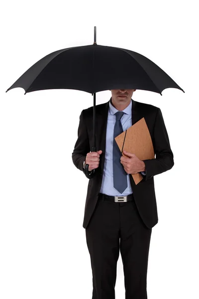 stock image Businessman holding an umbrella