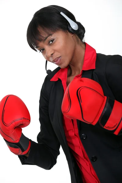 Call-center worker wearing boxing gloves — Stock Photo, Image