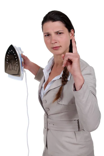 Annoyed woman with an iron — Stock Photo, Image