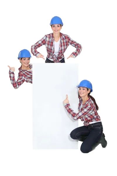 Triplet girls wearing safety hat — Stock Photo, Image