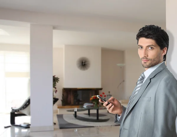 Elegant businessman in his fancy house — Stock Photo, Image