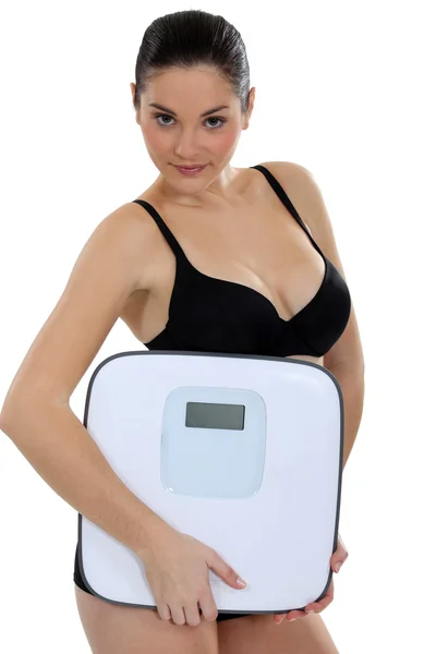 Mulher de cueca carregando balanças — Fotografia de Stock