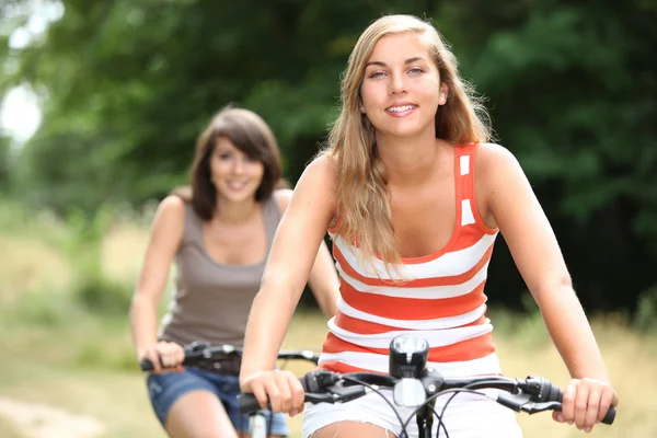 Girls on bikes — Stock Photo, Image