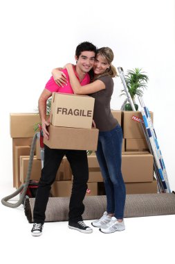 Young couple moving in together clipart