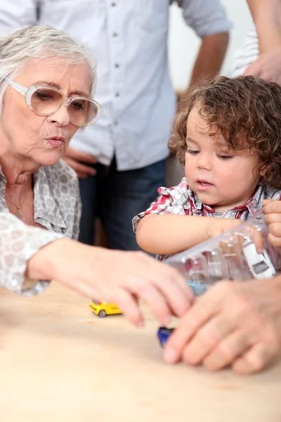 Grandmother playing with grandson — Stock Photo, Image