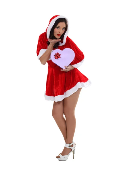 Full-length portrait of foxy mother Christmas with box in shape of heart — Stock Photo, Image