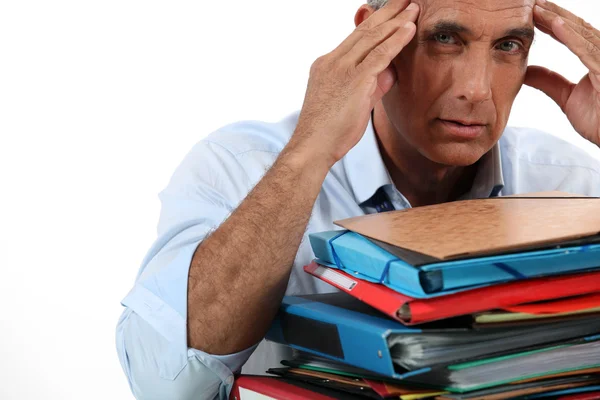 Man with stacks of work — Stock Photo, Image