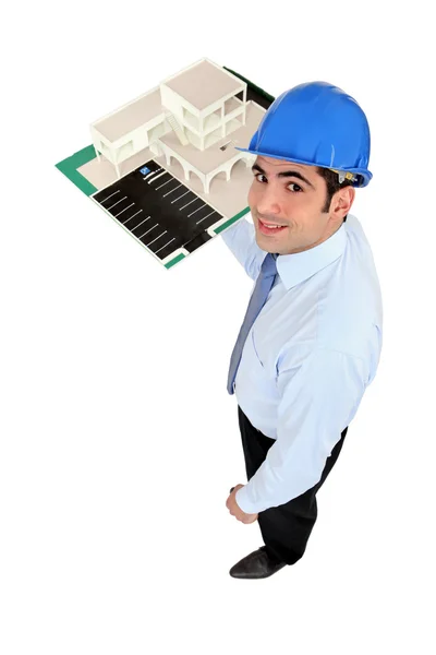 Man holding model housing development — Stock Photo, Image