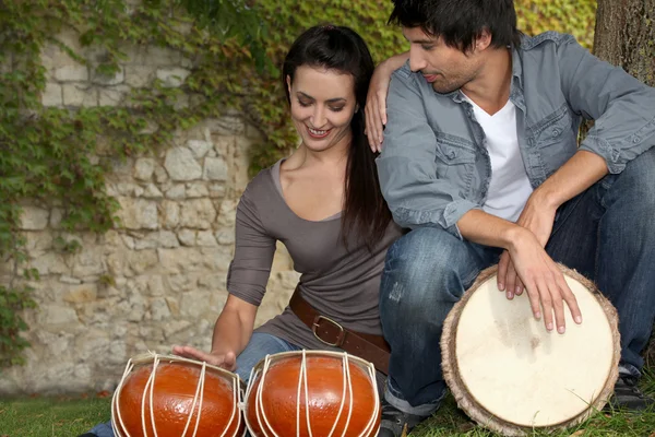 Couple with drums — Stock Photo, Image