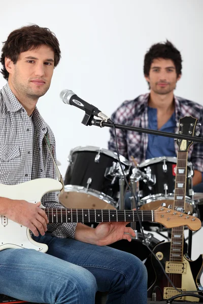 Youth with guitar and drums — Stock Photo, Image