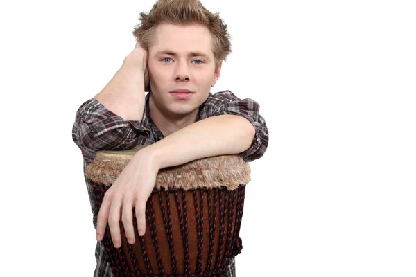 Young man with a djembe drum — Stock Photo, Image