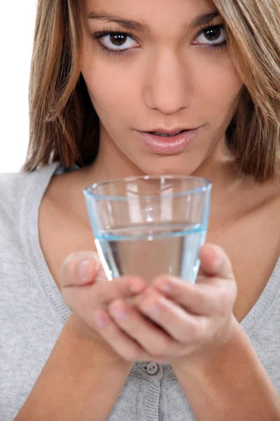 Woman holding a glass of water — Stock Photo, Image