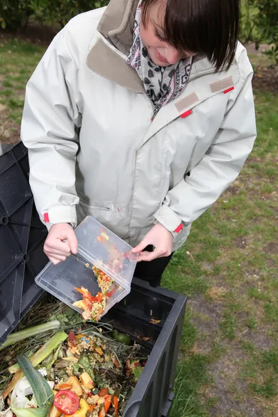 Woman making a compost — Stock Photo, Image