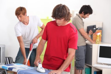 Three young male house-mates cleaning clipart