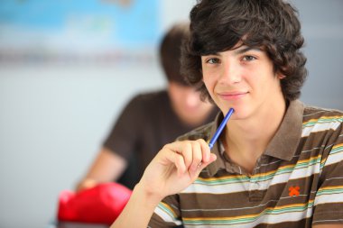 A teenage boy in the classroom