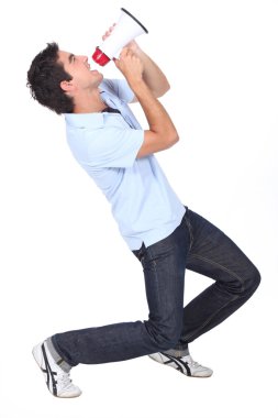 Young man yelling in a megaphone clipart