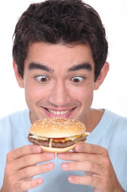 Man holding cheeseburger clipart