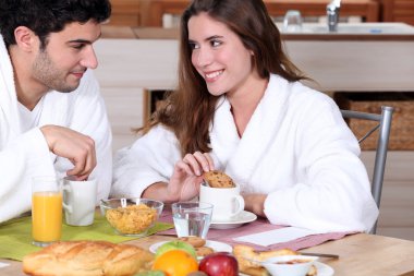 Couple having breakfast together clipart