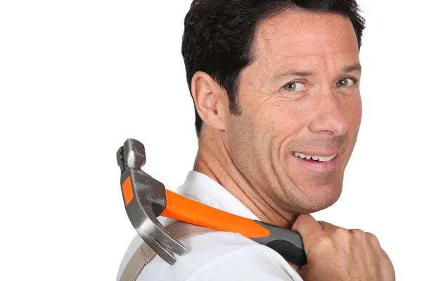 Man carrying hammer on his shoulder — Stock Photo, Image