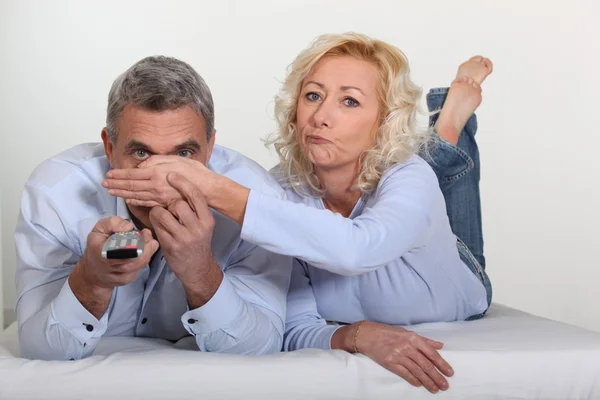 Woman covering her husband's eyes — Stock Photo, Image