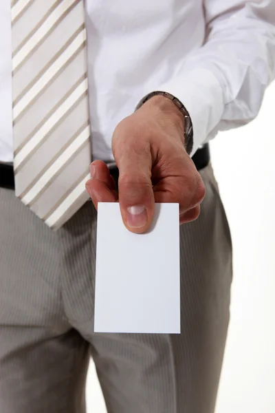 Businessman holding a visit card — Stock Photo, Image