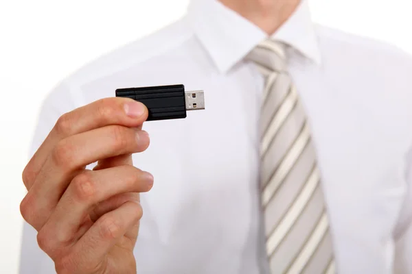 Üzletember kezében USB bottal — Stock Fotó