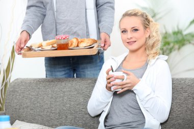 Man serving woman breakfast clipart