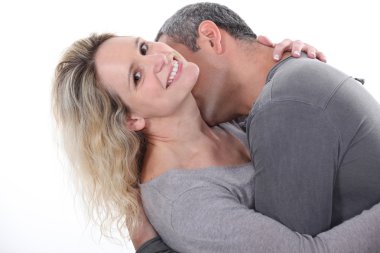 Man kissing his wife's neck clipart