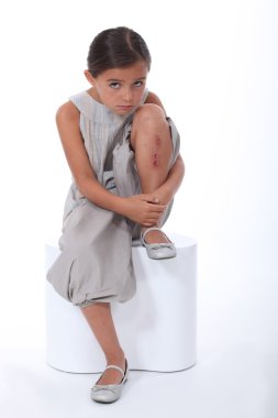 Portrait of little girl with injury clipart