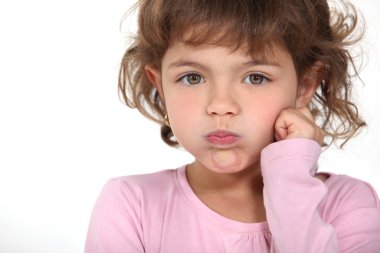 Little girl blowing her cheeks clipart