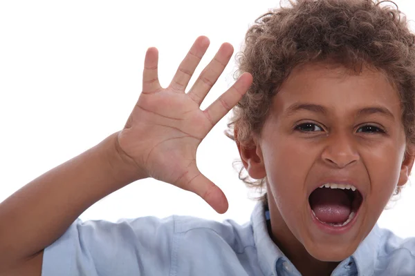 Little boy with raised hand — Stock Photo, Image
