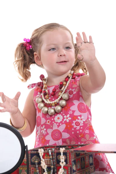 Girl putting on jewellery — Stock Photo, Image