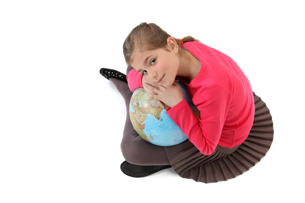 Little girl holding a globe — Stock Photo, Image