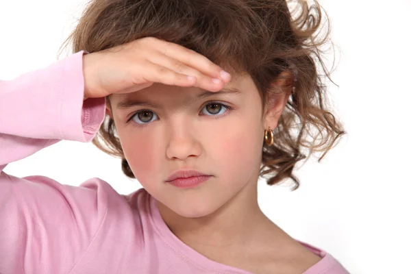 Young girl shading her eyes Royalty Free Stock Photos