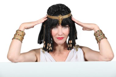 Woman dressed in Egyptian outfit with message board clipart