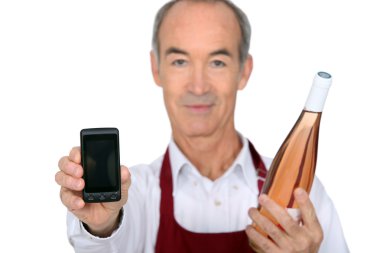 Waiter with bottle and phone clipart