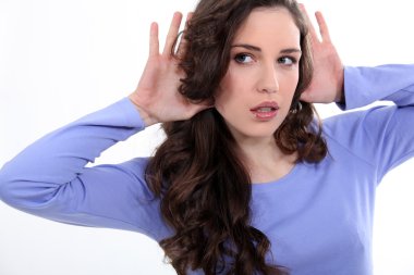 Woman with her hands to her ears clipart