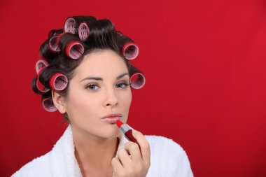 Woman beautifying herself clipart