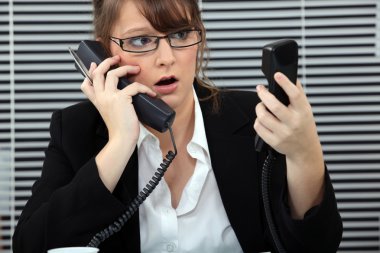 Secretary overwhelmed by phone calls clipart